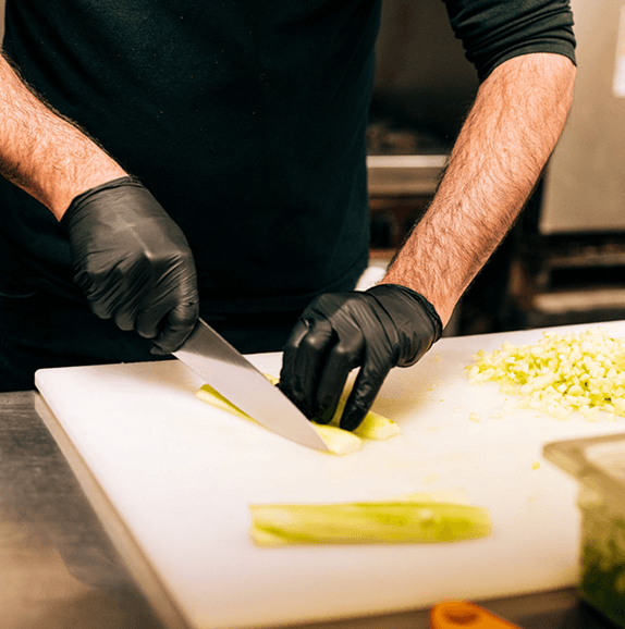 Chef preparing food at Seniors West of the Tetons